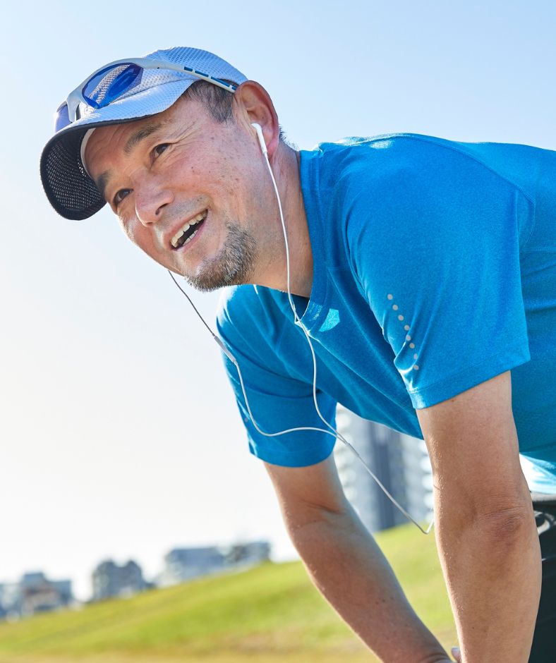 man wearing blue shirt engaging in sports